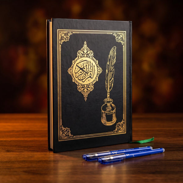 المصحف المظلل بغلافه الأسود والزخرفة الدهبي ومعاه قلمين